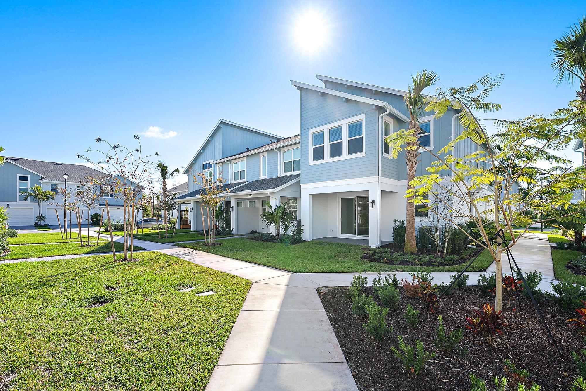 16377 Biltmore Landing Loxahatchee, FL 33470 - Photo 7 of 23 a front view of a house with a garden