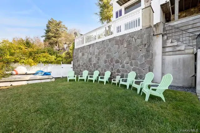 a green bench sitting in the middle of a building