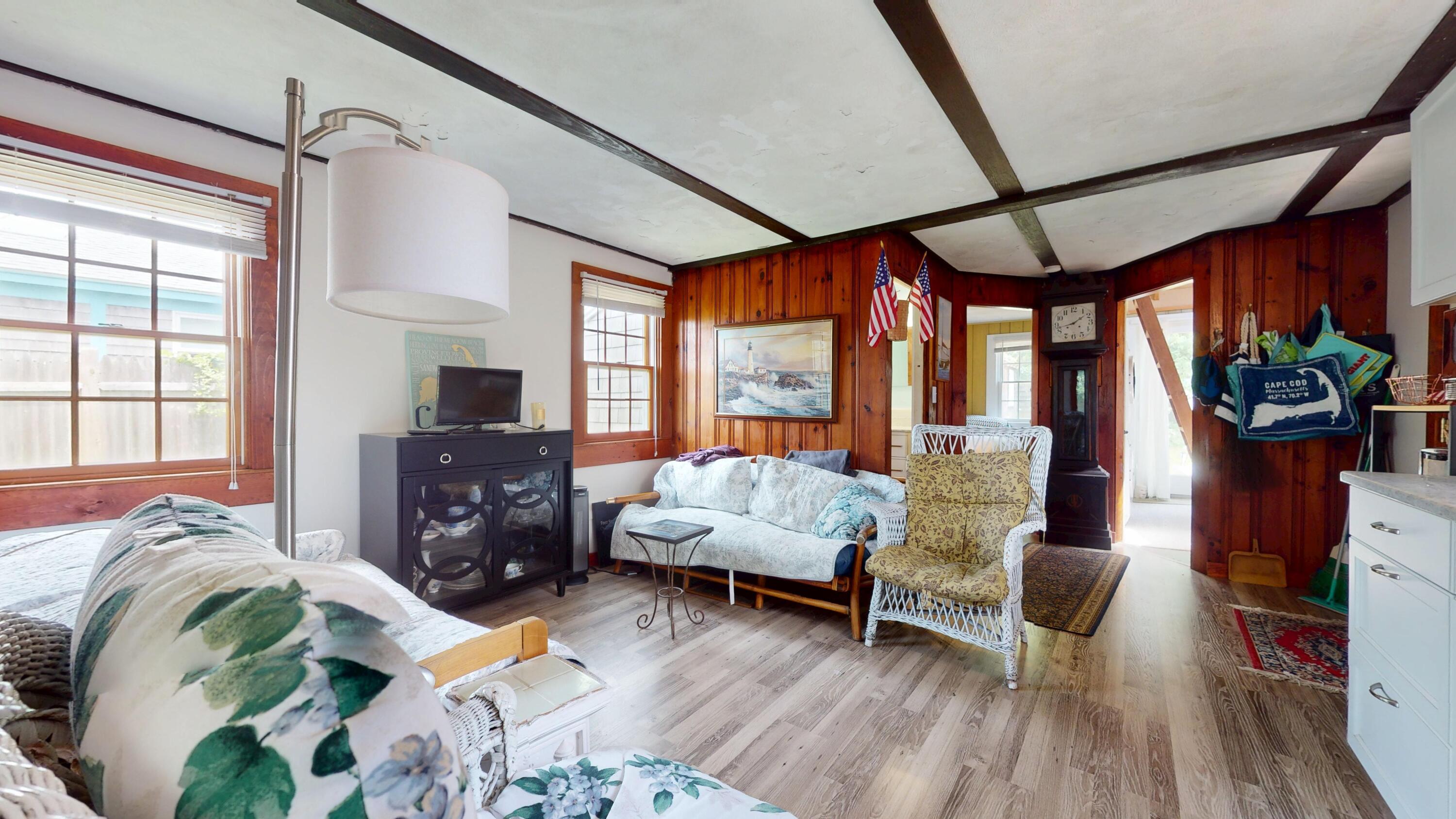 18 Myrtle Lane Dennis Port, MA 02639 - Photo 11 of 25 a bedroom with furniture and a wooden floor