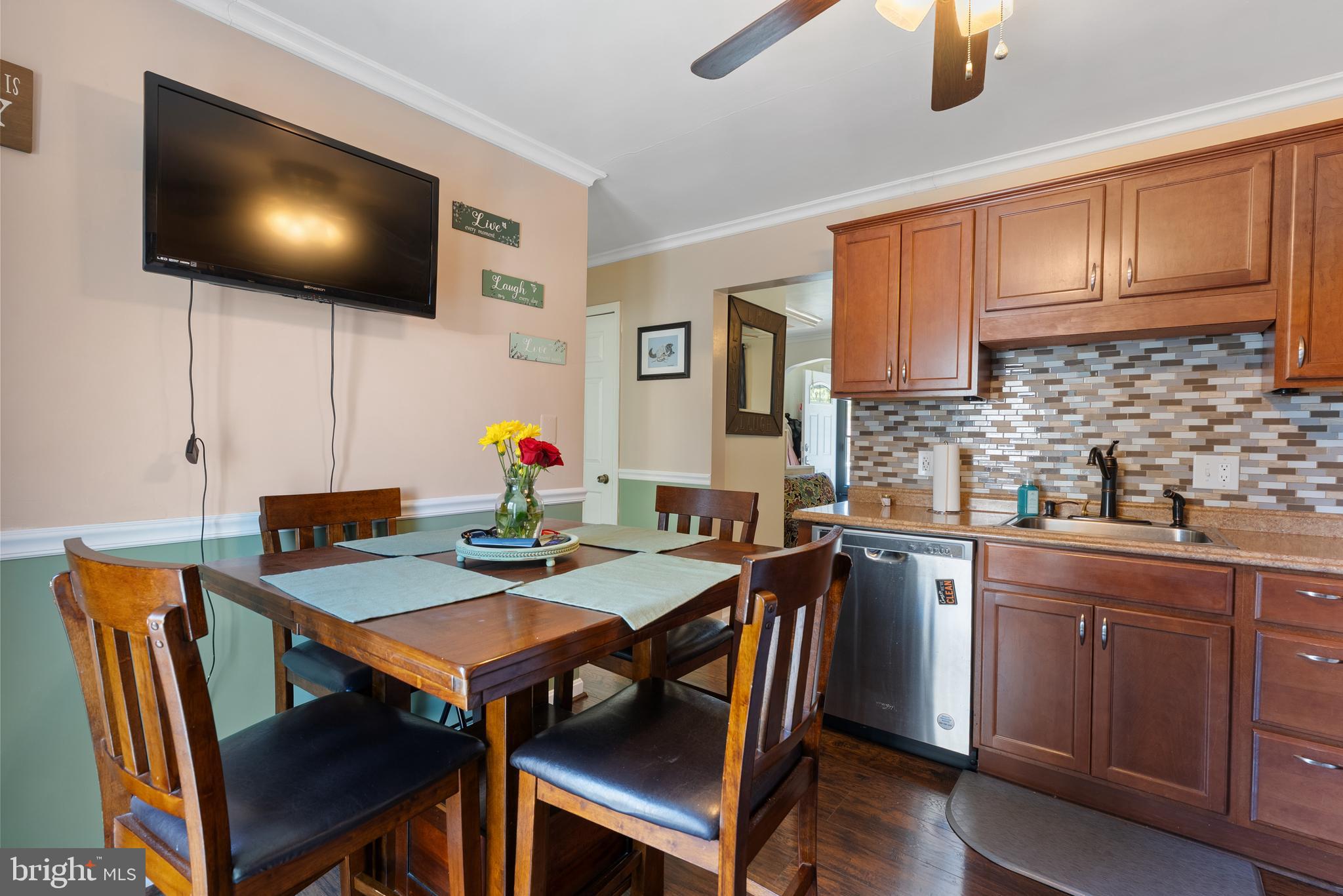 70 Del Rio Road Baltimore, MD 21222 - Photo 9 of 40 a view of kitchen with cabinets dining table and chairs