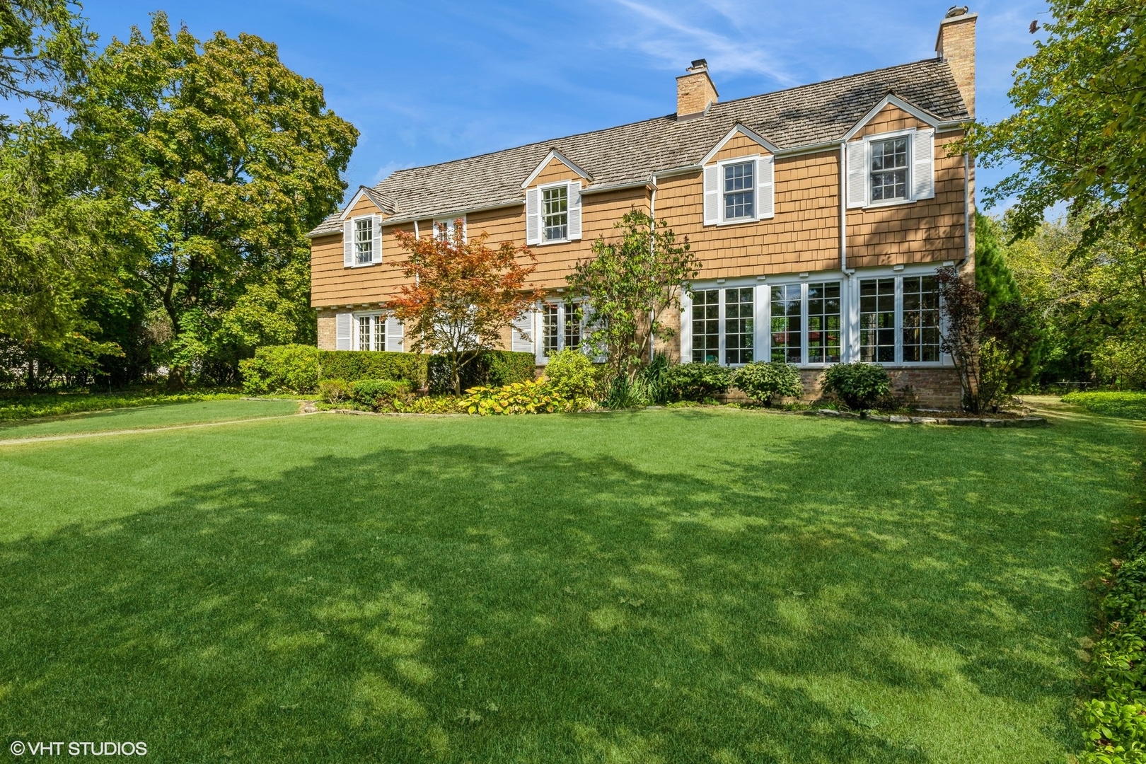 753 York Road Glenview, IL 60025 - Photo 1 of 17 a front view of a house with a yard