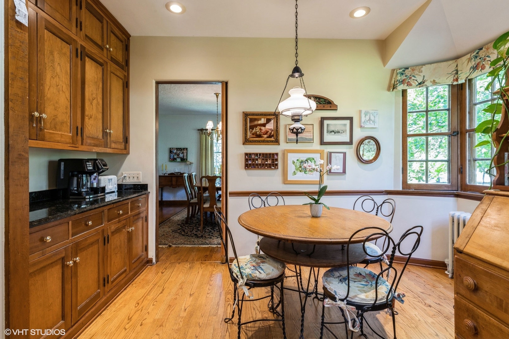 753 York Road Glenview, IL 60025 - Photo 6 of 17 a kitchen with stainless steel appliances a table and chairs in it