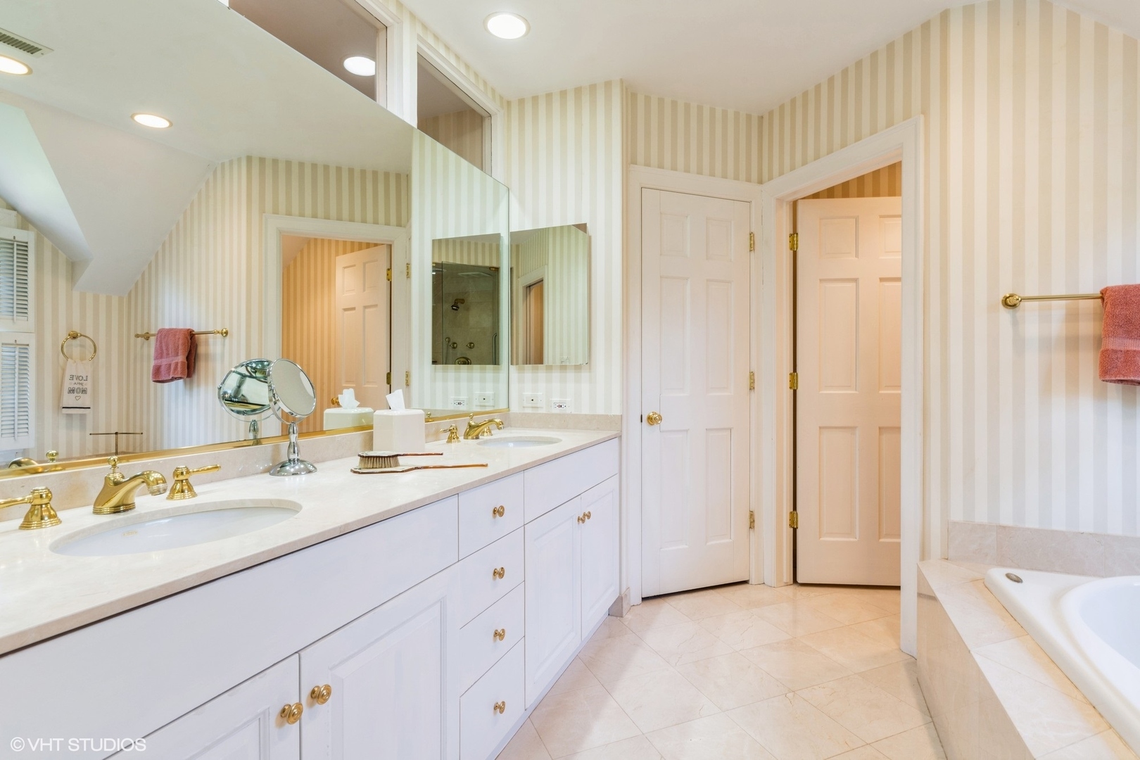 753 York Road Glenview, IL 60025 - Photo 9 of 17 a spacious bathroom with a double vanity sink a mirror and a shower