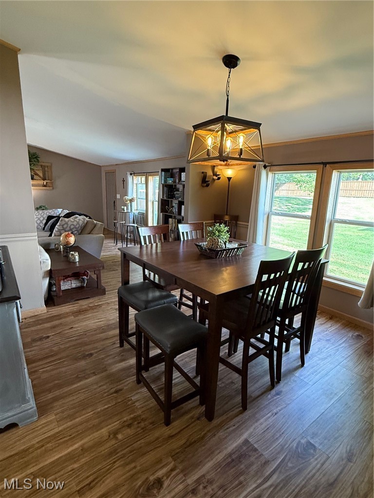 3868 Cook Road Rootstown, OH 44272 - Photo 9 of 44 Dining space featuring dark wood-style flooring and a chandelier