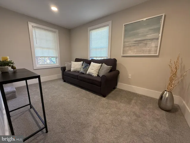 a bedroom with a bed and a chair