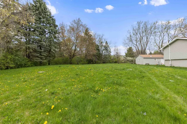a view of a backyard with a garden