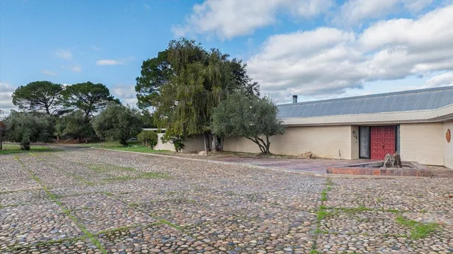 a view of empty room with wooden floor and city view