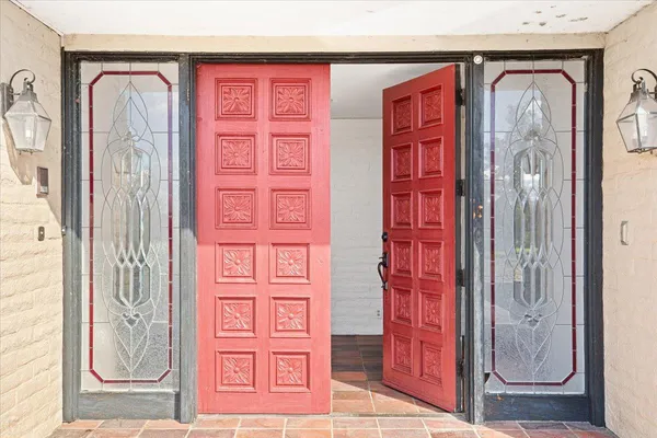 a kitchen with stainless steel appliances a stove and more cabinets