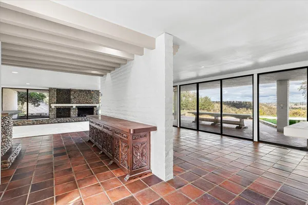 a kitchen with granite countertop a stove and a shower