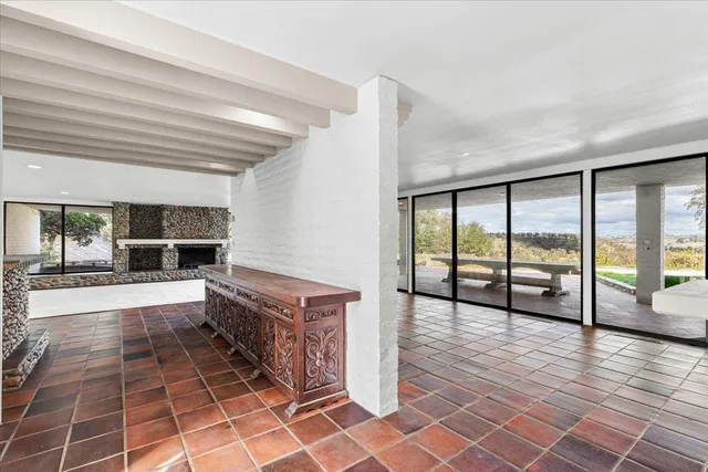 a kitchen with stainless steel appliances a stove and more cabinets
