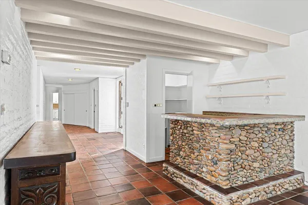 a kitchen with stainless steel appliances granite countertop a stove and a refrigerator