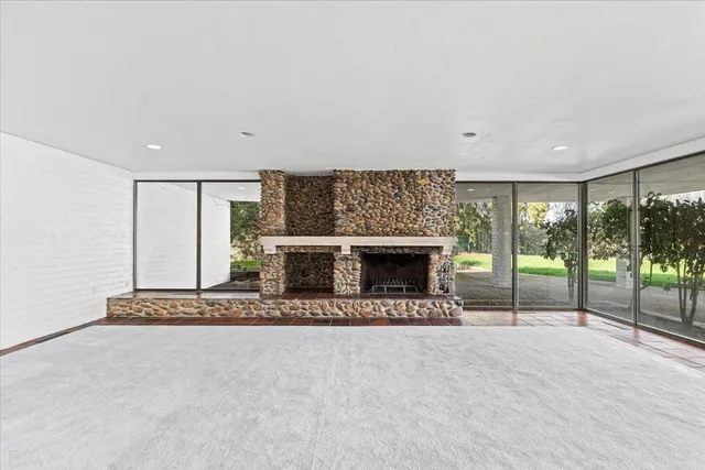 a bedroom with a bed and a mirror