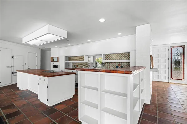 a view of a room with large windows and city view