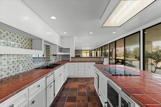 a view of a room with large windows and city view