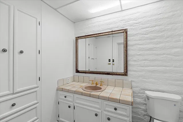 a bathroom with a double vanity sink and a shower