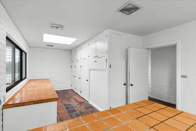 a view of swimming pool with outdoor seating and a yard