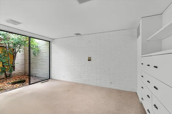 an aerial view of a houses with a yard