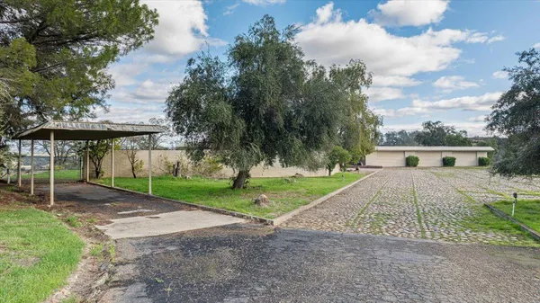 a view of empty room with wooden floor and city view