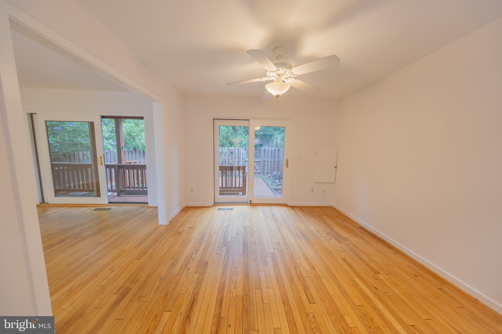 2201 Cedar Cove Court Reston, VA 20191 - Photo 5 of 25 Hardwood dining room with deck access.