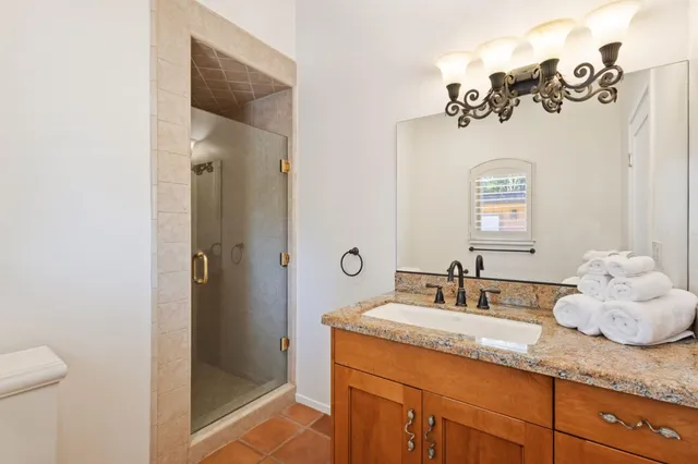 a utility room with granite countertop cabinets washer and dryer