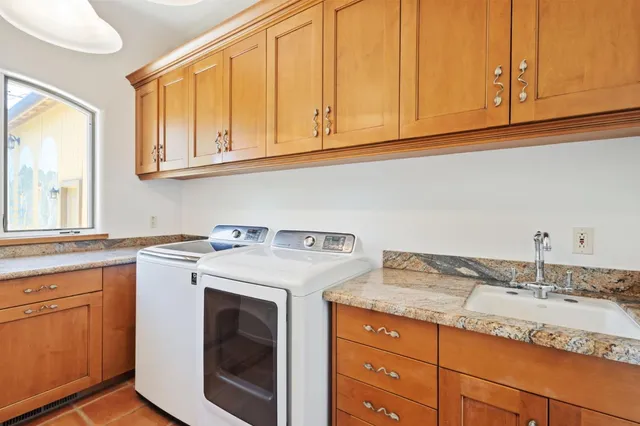 a dining room with furniture a chandelier and wooden floor