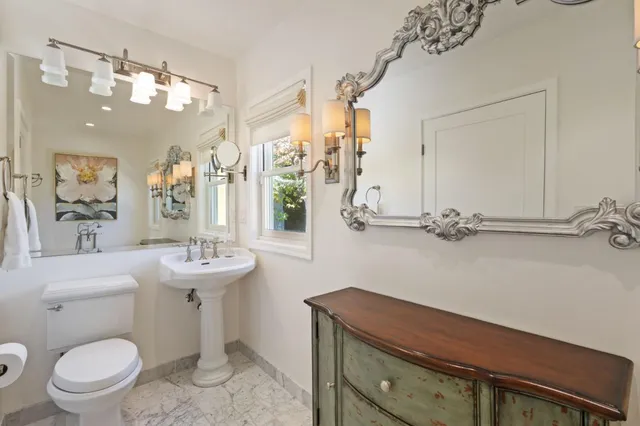 a kitchen with a refrigerator and table chair