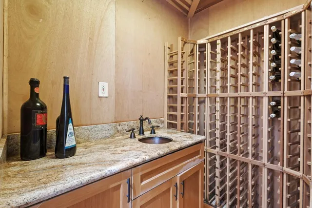 a bathroom with a granite countertop sink vanity and a mirror