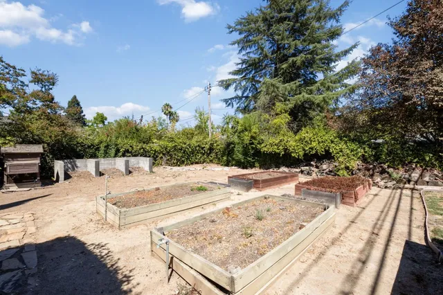 a backyard of a house with a yard and outdoor seating