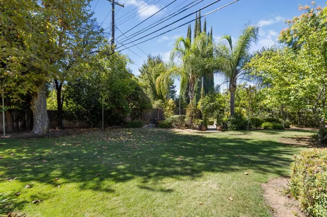 an aerial view of residential houses with city view