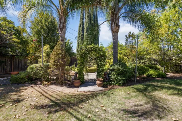 an aerial view of residential houses with city view