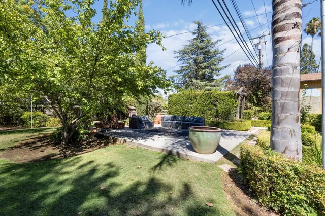 an aerial view of residential building with green space