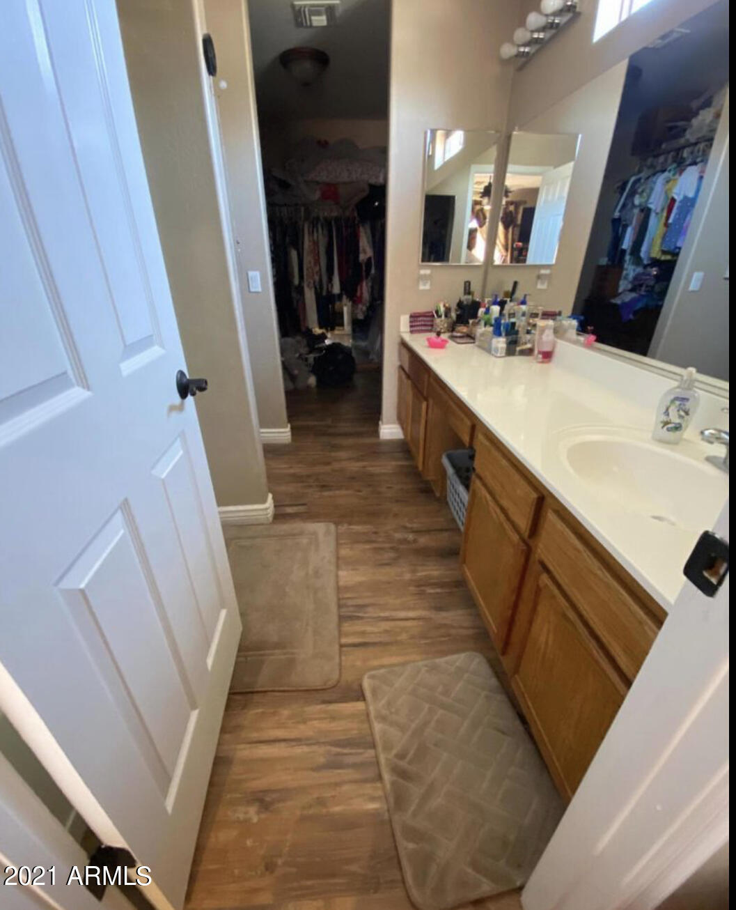 3310 West Fraktur Road Phoenix, AZ 85041 - Photo 17 of 17 a bathroom with a double vanity sink and a mirror