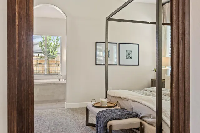a bathroom with a tub and sink