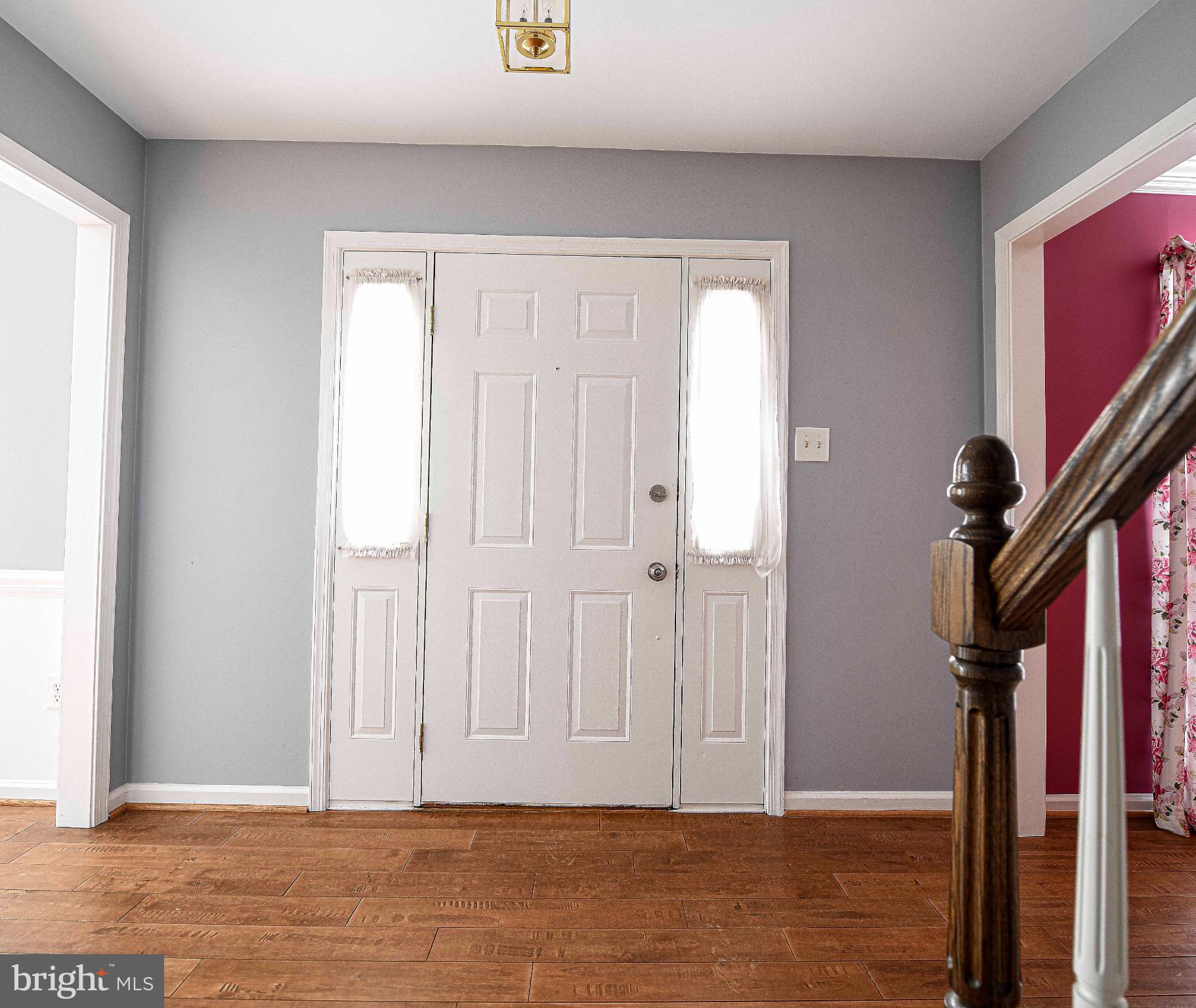 644 Symphony Woods Drive Silver Spring, MD 20901 - Photo 17 of 53 a view of a livingroom with hardwood floor and staircase