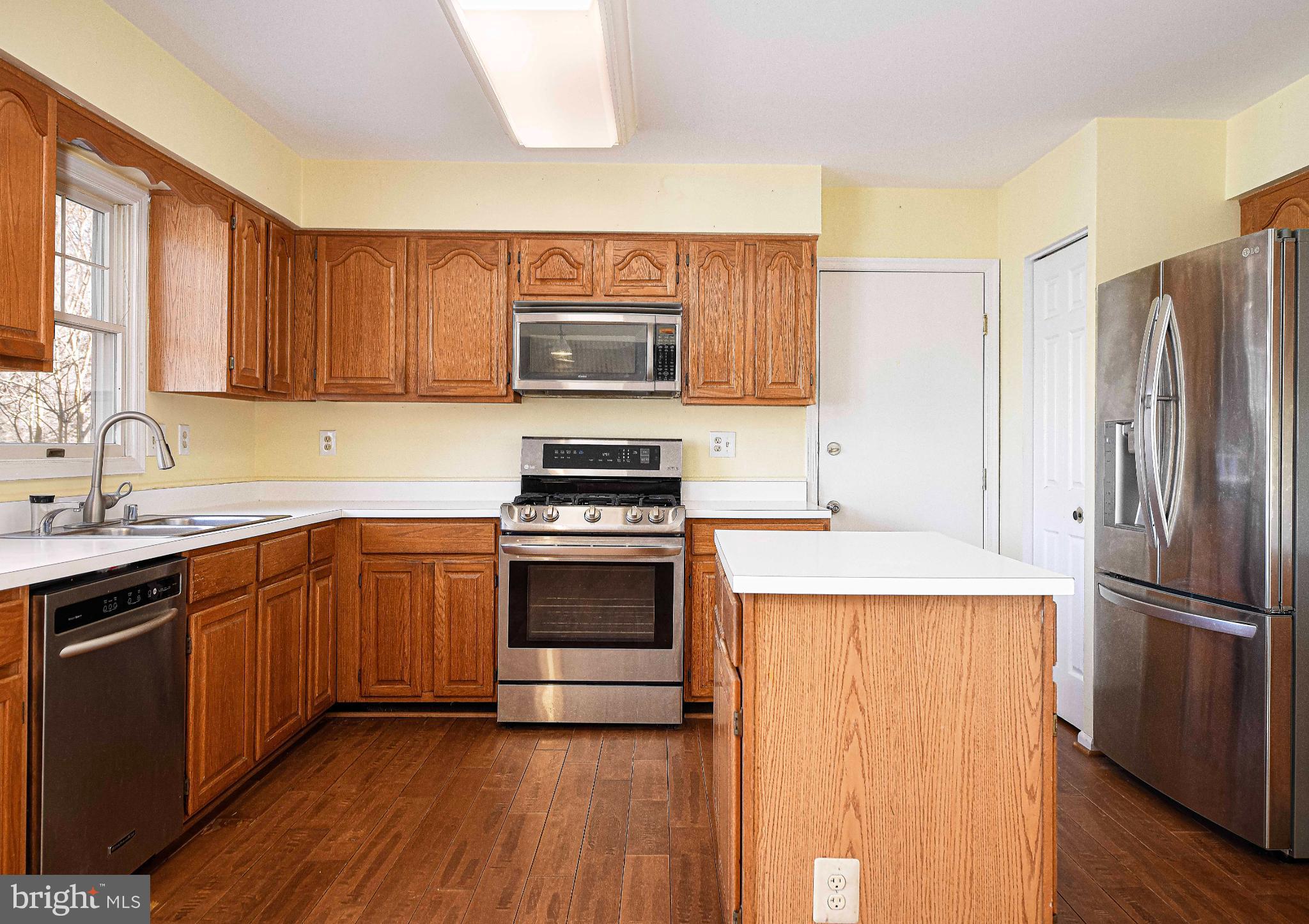 644 Symphony Woods Drive Silver Spring, MD 20901 - Photo 21 of 53 a kitchen with a refrigerator sink and microwave