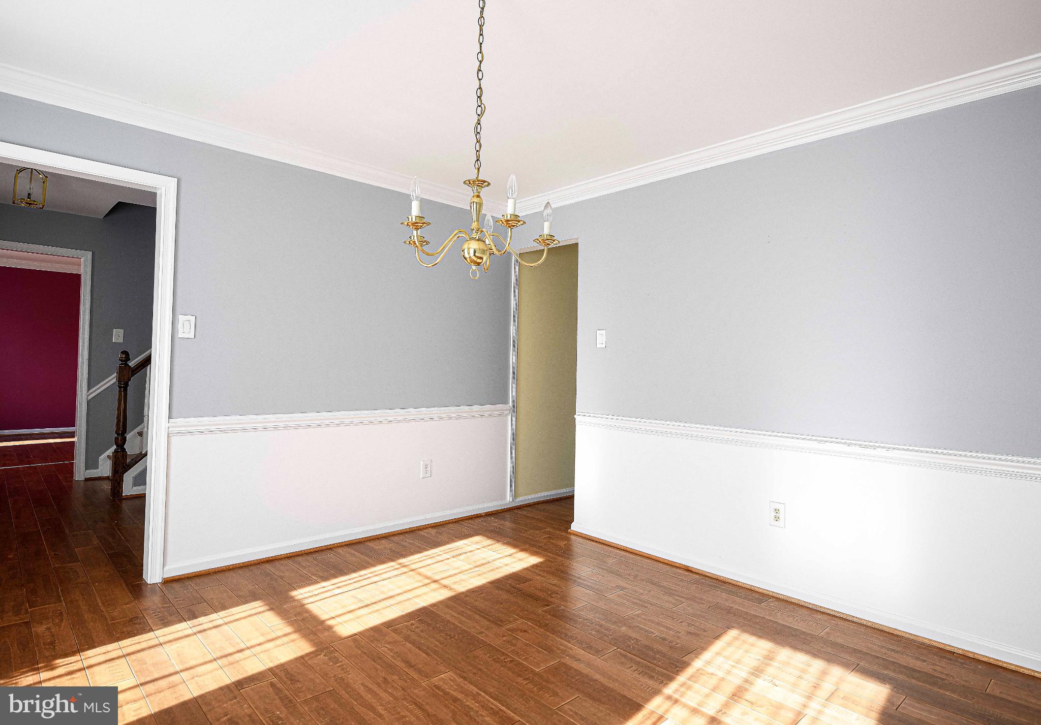 644 Symphony Woods Drive Silver Spring, MD 20901 - Photo 24 of 53 a view of a room with wooden floor and white walls