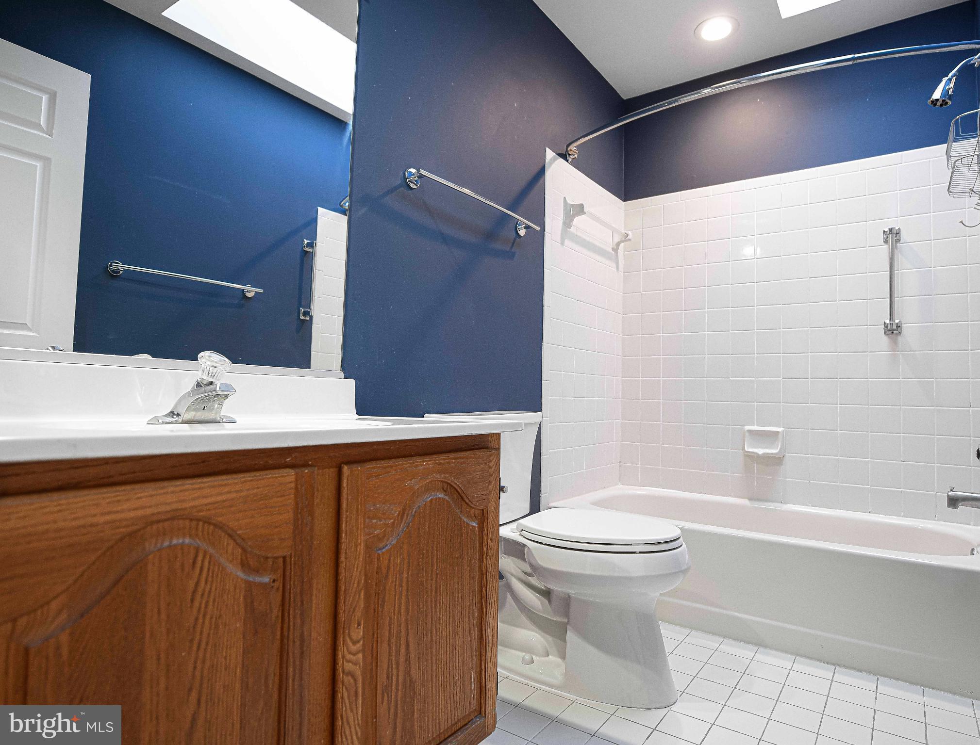 644 Symphony Woods Drive Silver Spring, MD 20901 - Photo 38 of 53 a bathroom with a sink a toilet and shower