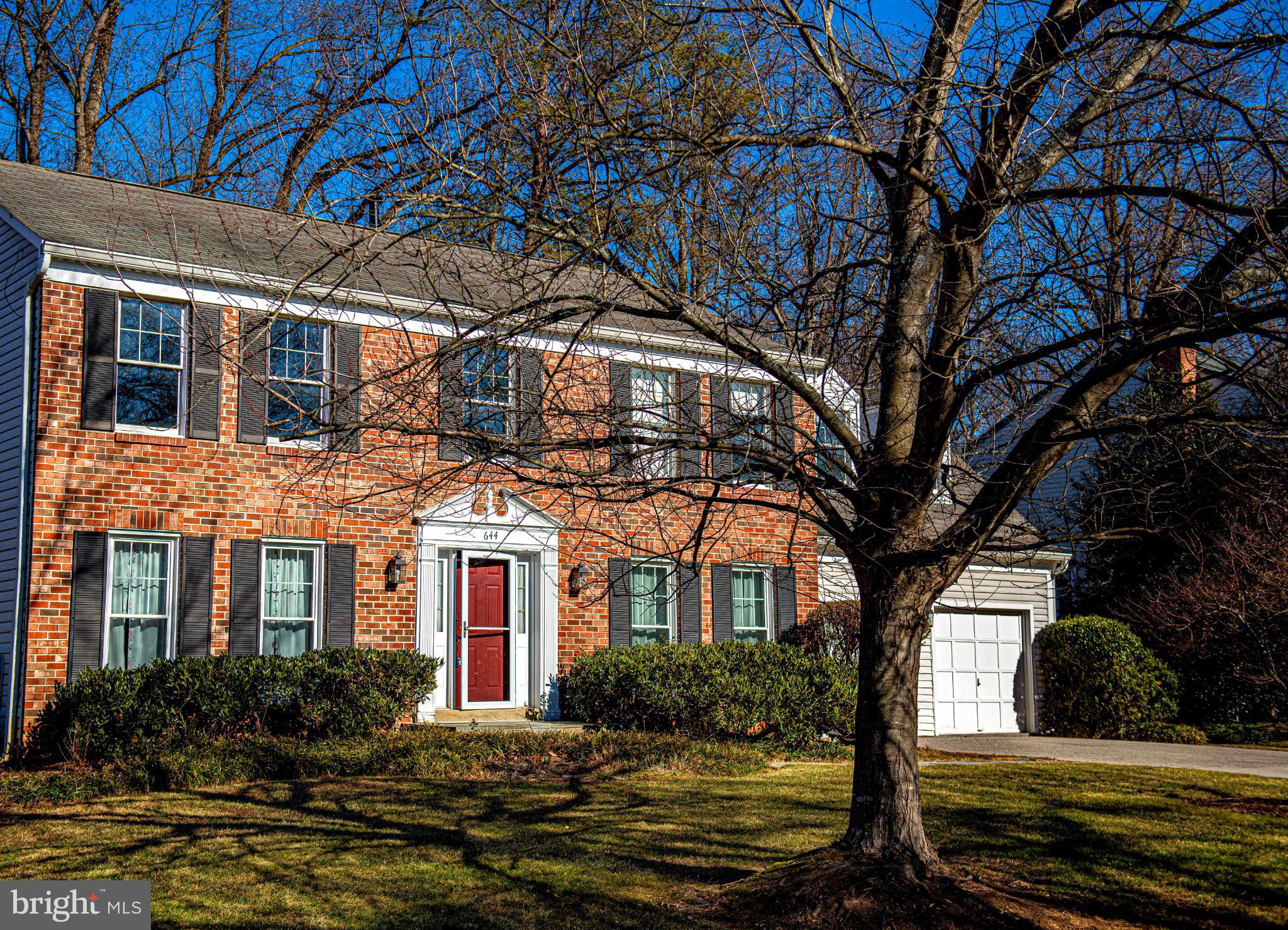 644 Symphony Woods Drive Silver Spring, MD 20901 - Photo 4 of 53 a front view of a house with a yard