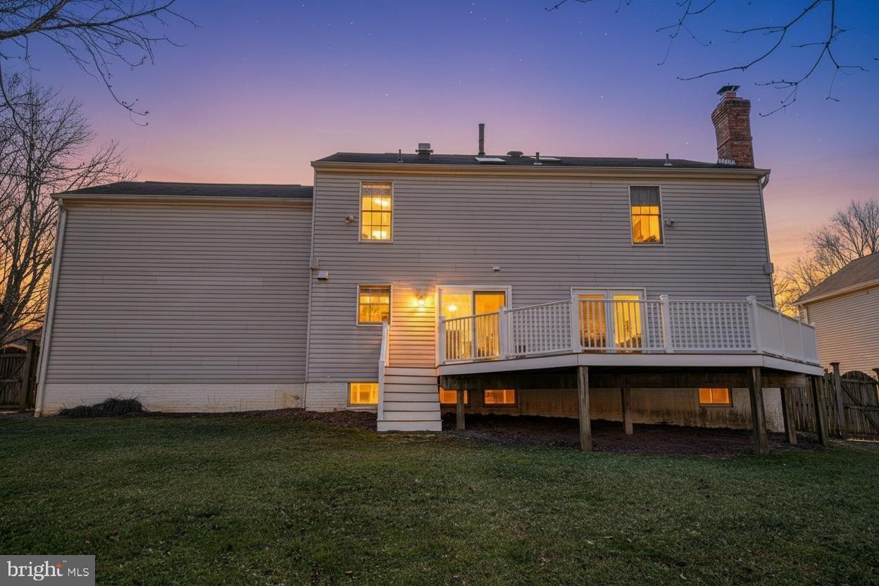644 Symphony Woods Drive Silver Spring, MD 20901 - Photo 52 of 53 a view of a big house with a big yard and large trees