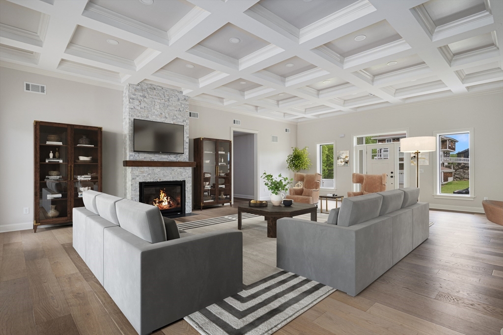 68 Richard Circle Seekonk, MA 02771 - Photo 17 of 40 a living room with furniture a fireplace and a flat screen tv