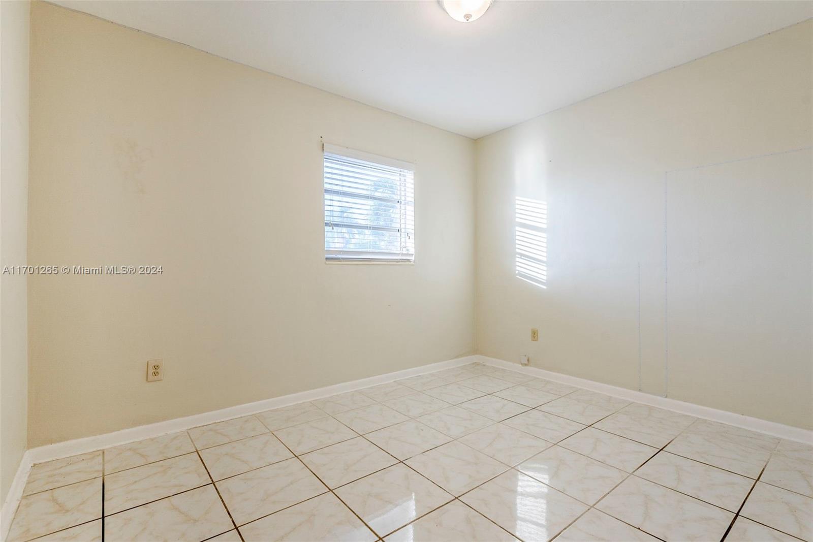 14281 Southwest 285th Street Homestead, FL 33033 - Photo 14 of 27 a view of an empty room and window