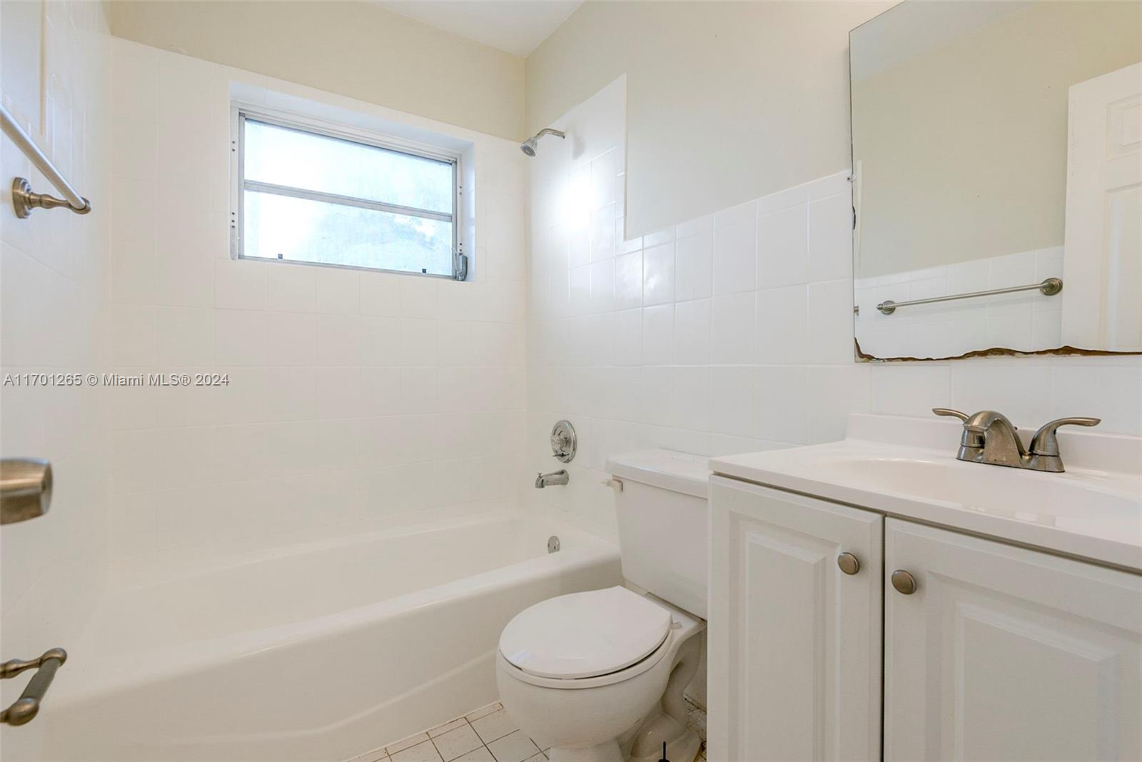 14281 Southwest 285th Street Homestead, FL 33033 - Photo 20 of 27 a bathroom with a sink a toilet and a bathtub