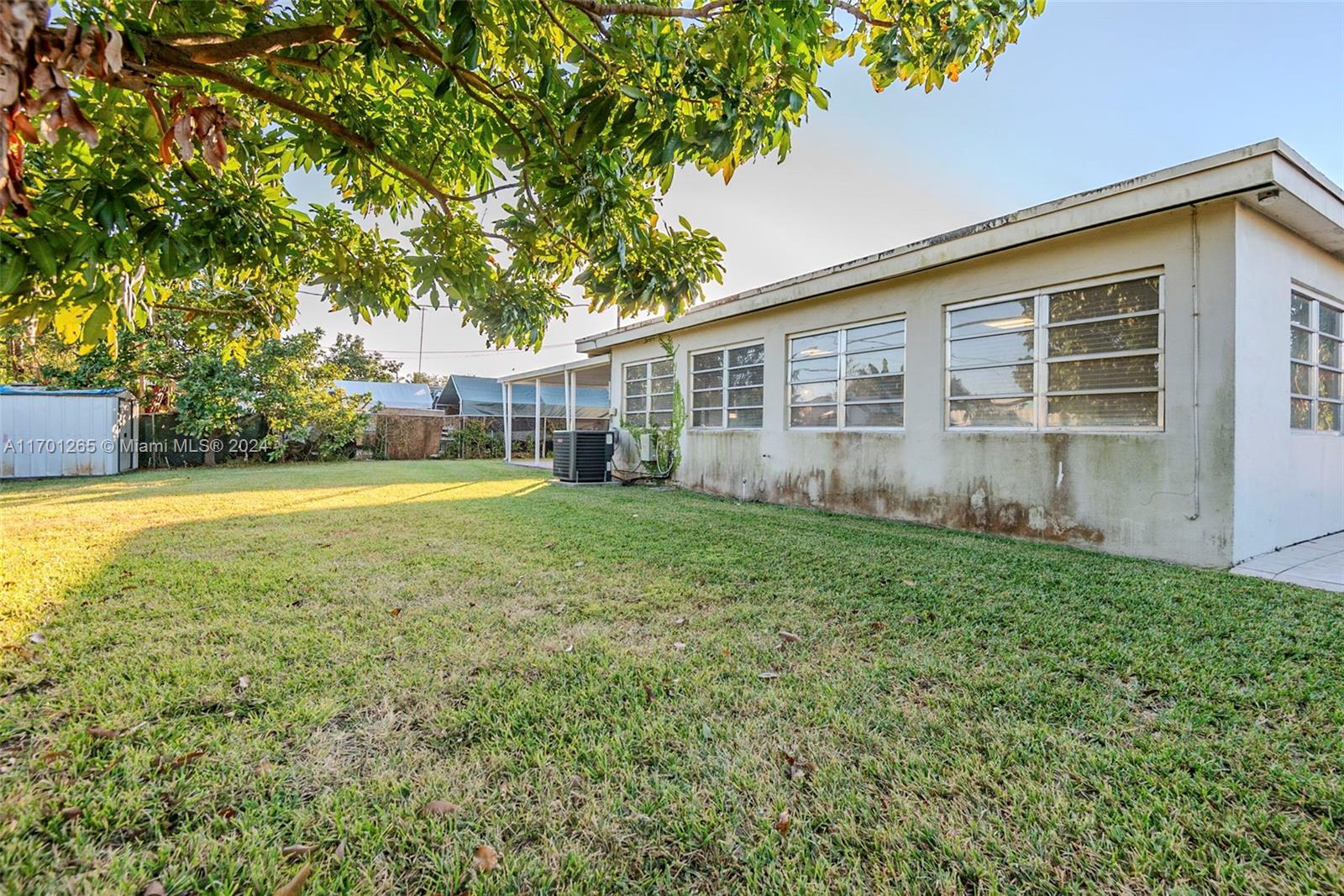14281 Southwest 285th Street Homestead, FL 33033 - Photo 24 of 27 a view of a house with a yard