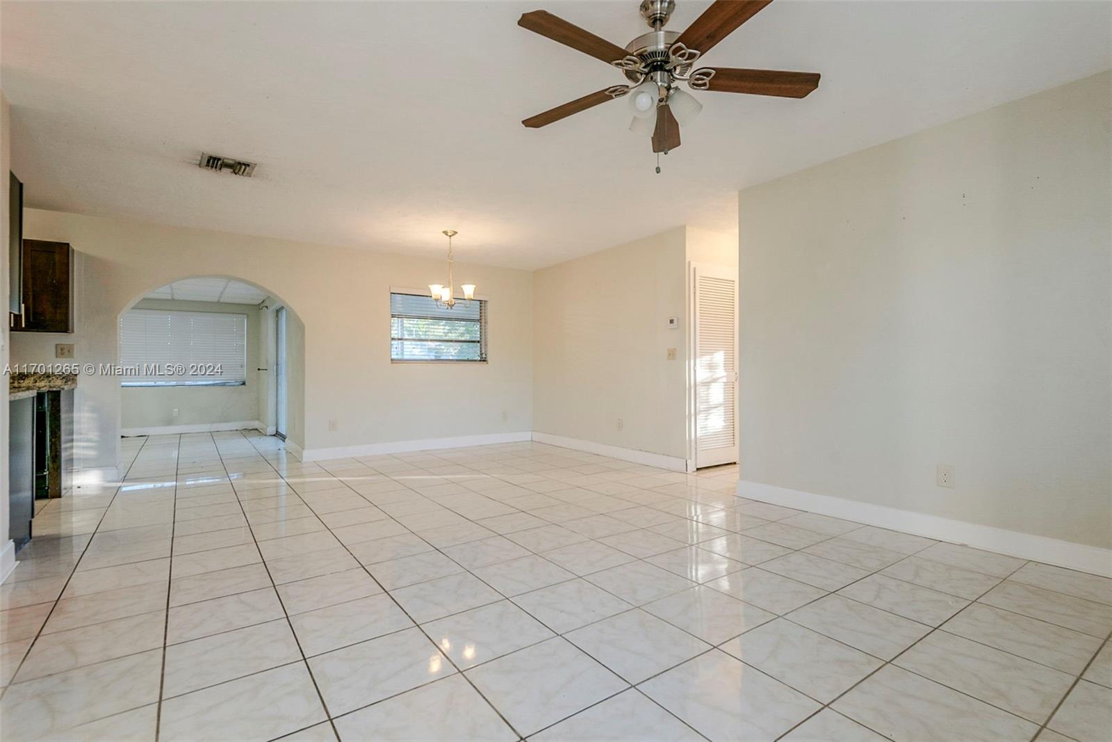 14281 Southwest 285th Street Homestead, FL 33033 - Photo 5 of 27 an empty room with fan and windows