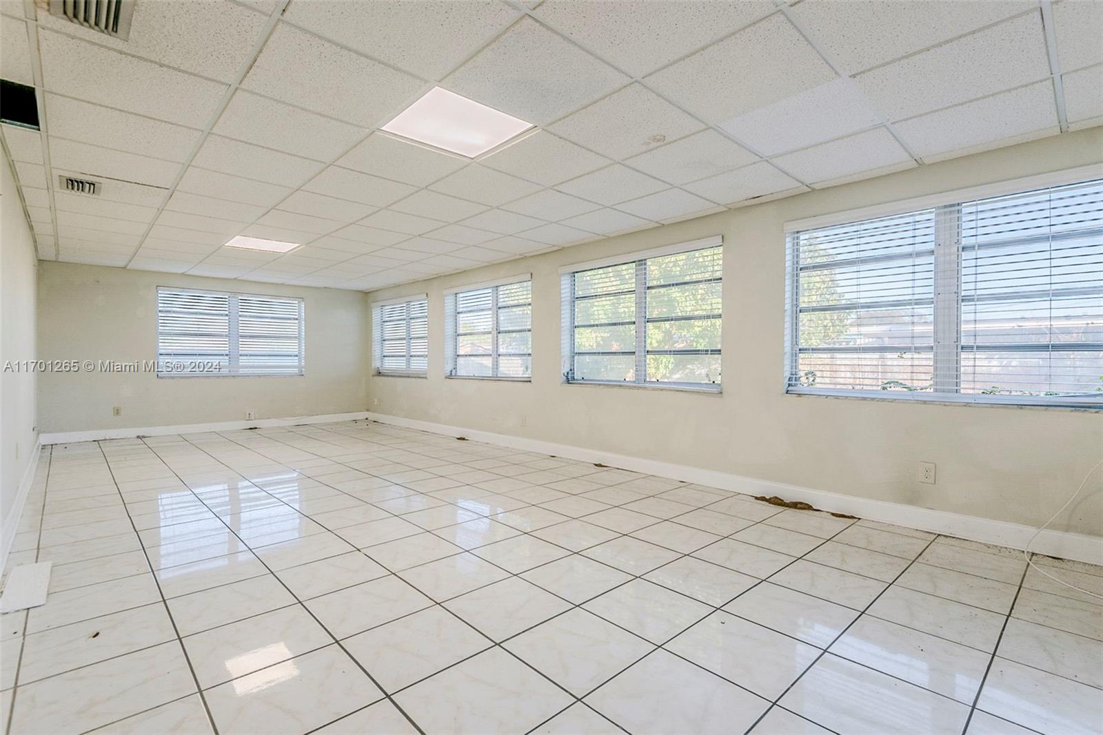 14281 Southwest 285th Street Homestead, FL 33033 - Photo 6 of 27 a view of an empty room and window