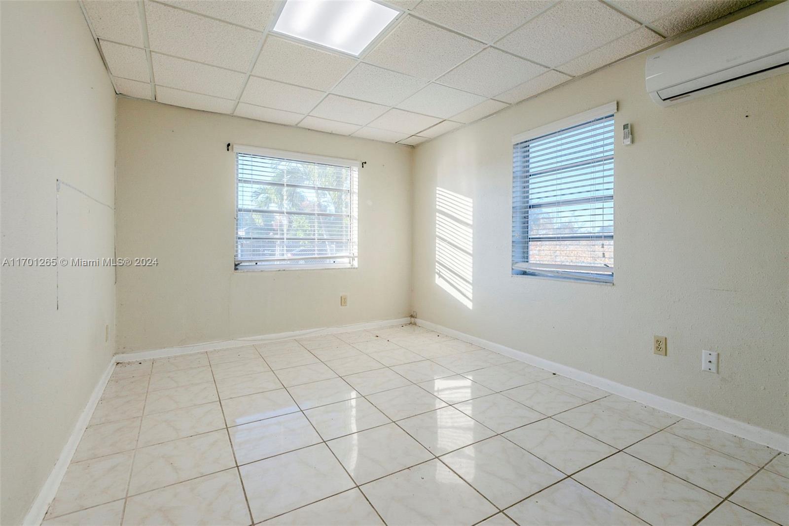 14281 Southwest 285th Street Homestead, FL 33033 - Photo 7 of 27 an empty room with windows