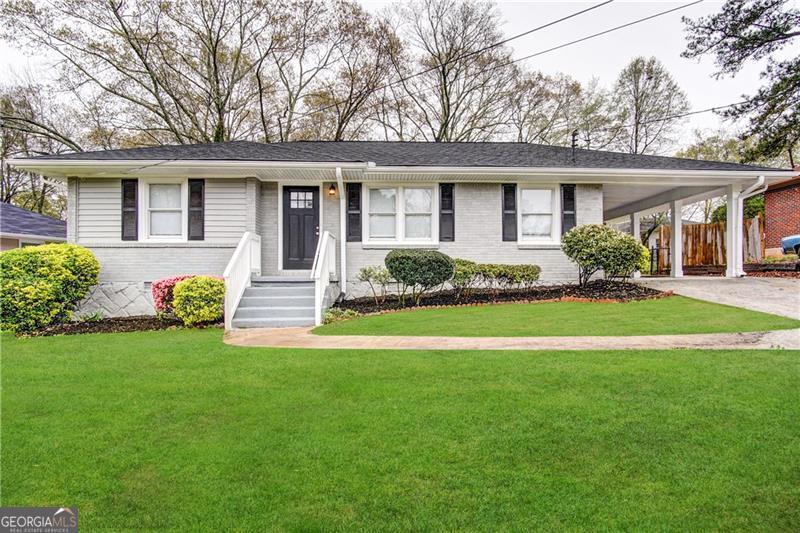 2605 Glenvalley Drive Decatur, GA 30032 - Photo 1 of 1 a front view of a house with a garden and porch