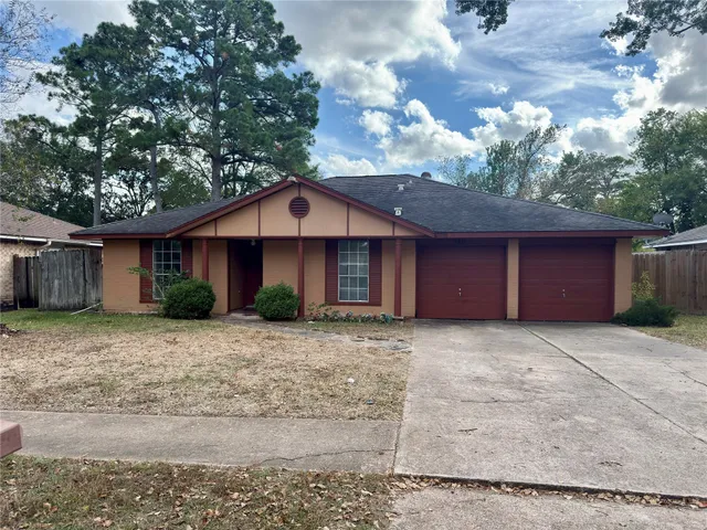 a front view of a house with yard