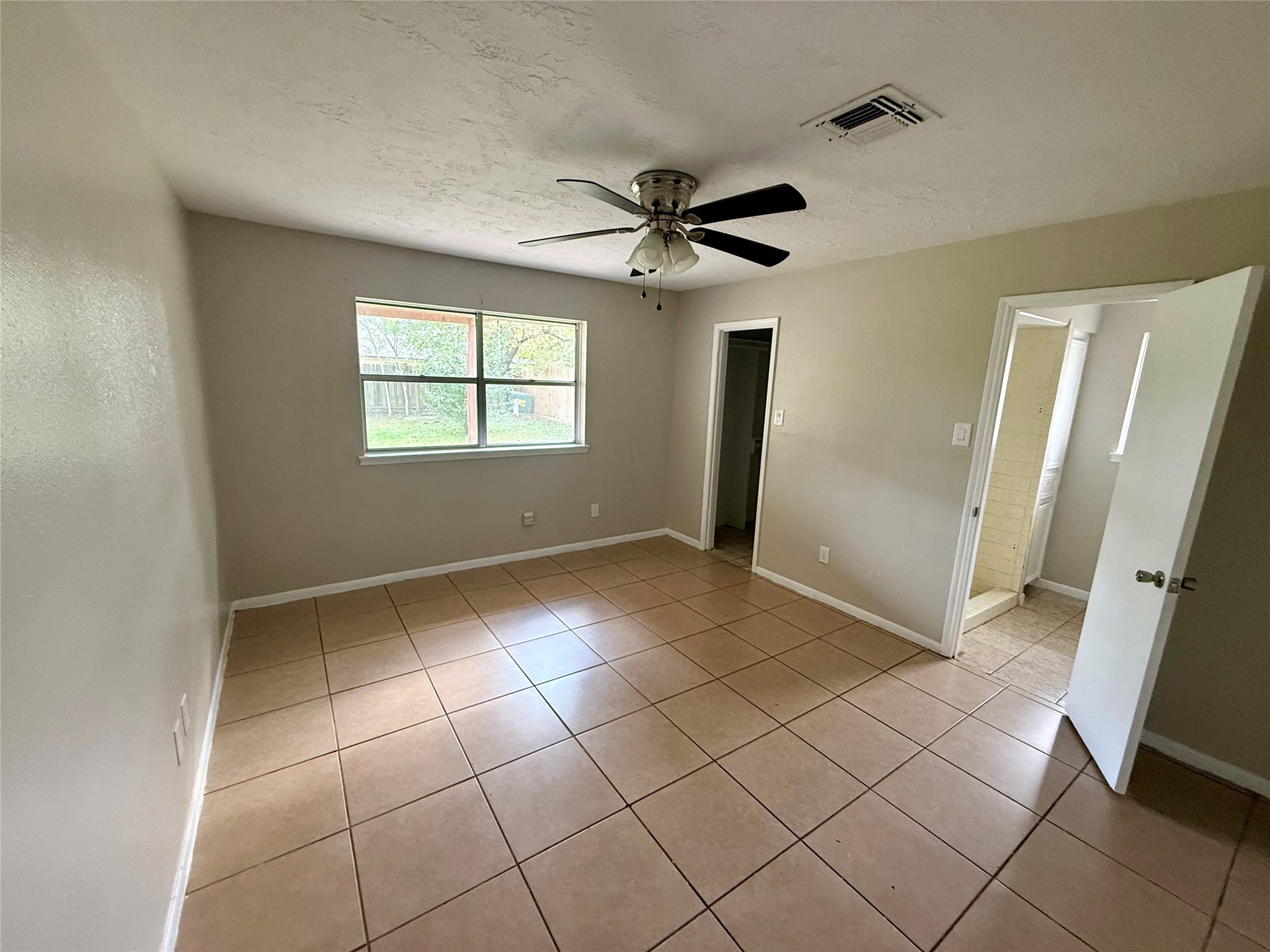 3211 Hartfield Lane Spring, TX 77388 - Photo 12 of 23 a view of an empty room with a window