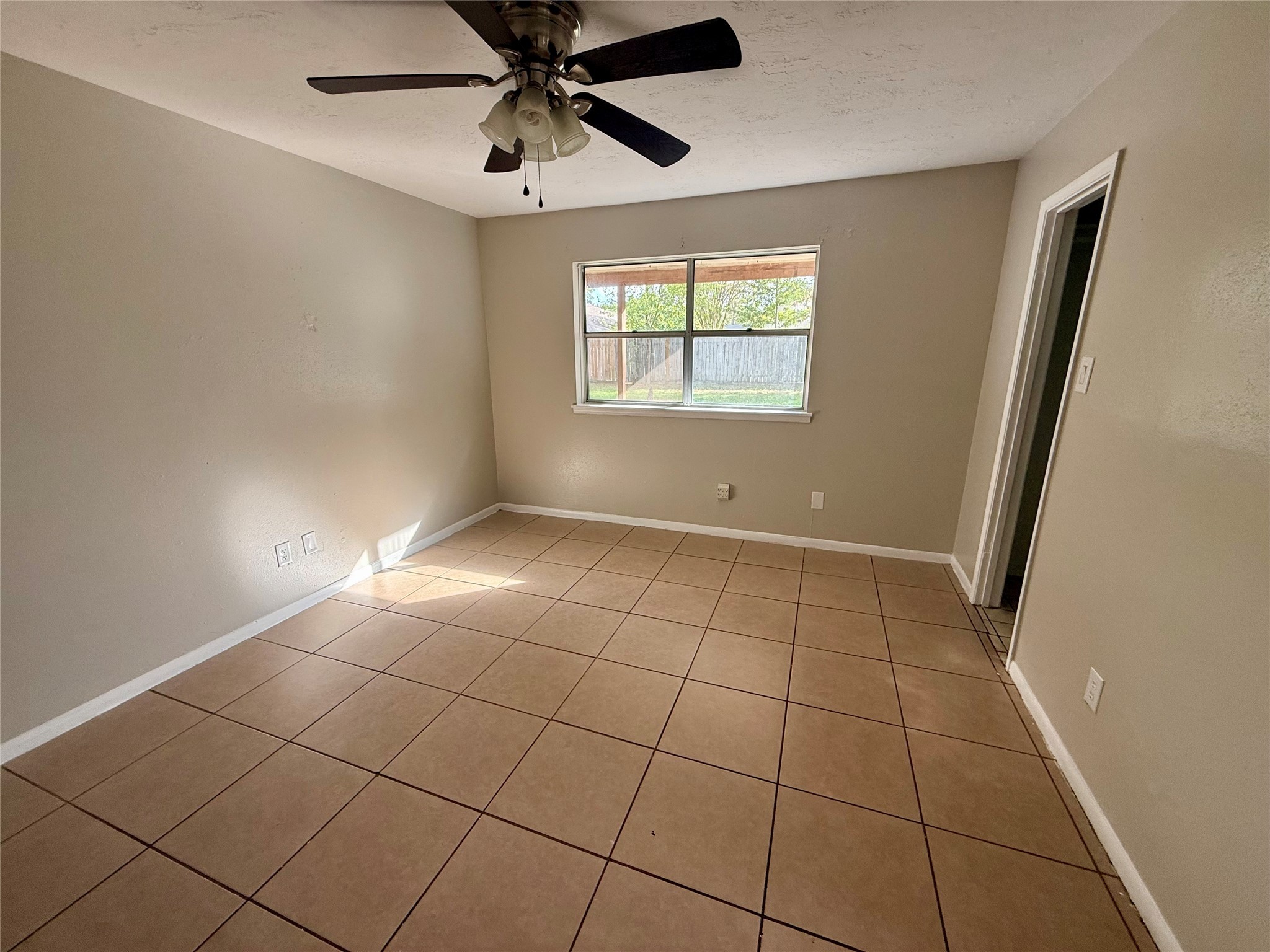 3211 Hartfield Lane Spring, TX 77388 - Photo 14 of 23 a view of an empty room with a window